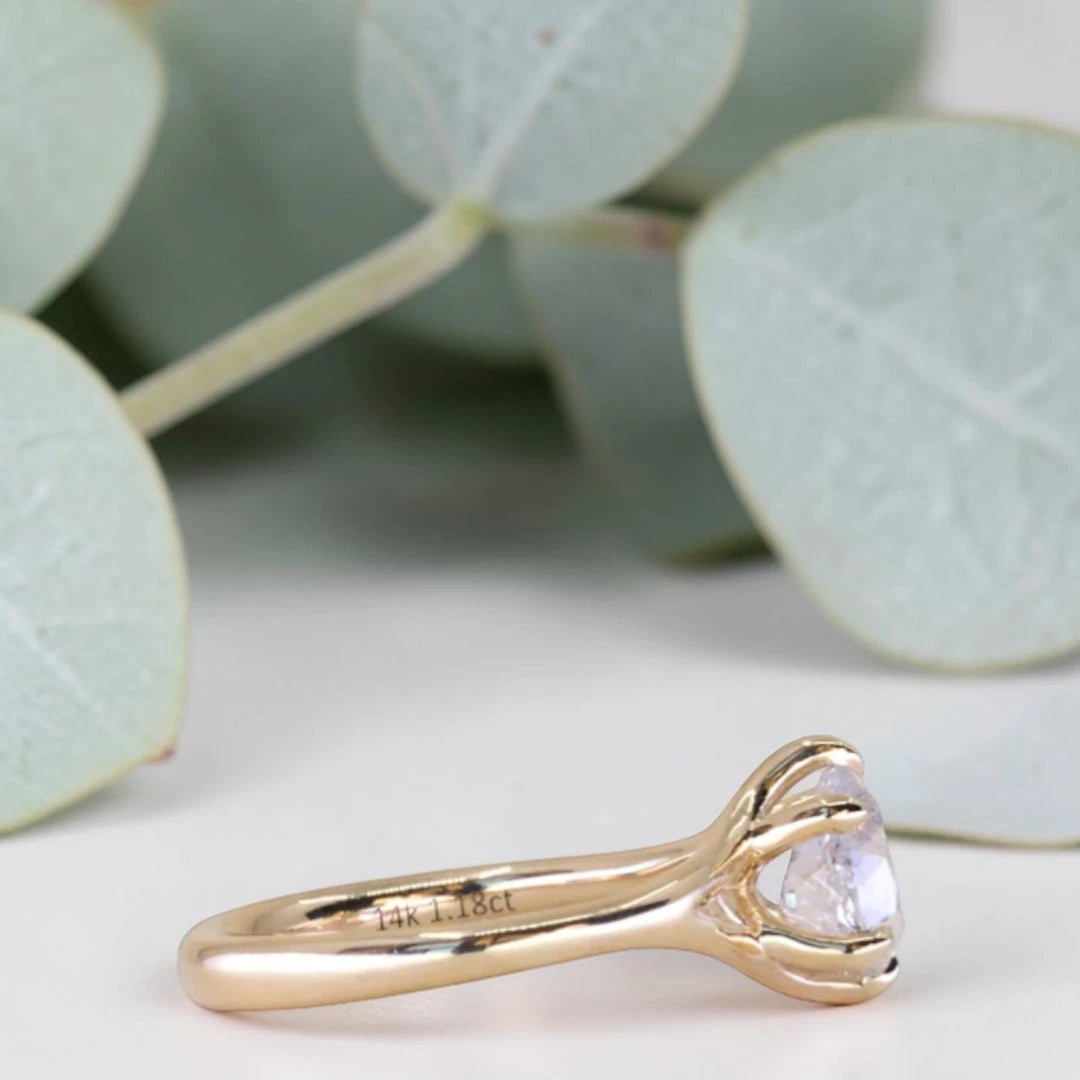 Pear cut salt and pepper diamond engagement ring featuring a 1.21 CT natural diamond with unique inclusions, set on a handcrafted split shank band in a minimalist alternative bridal jewelry design.