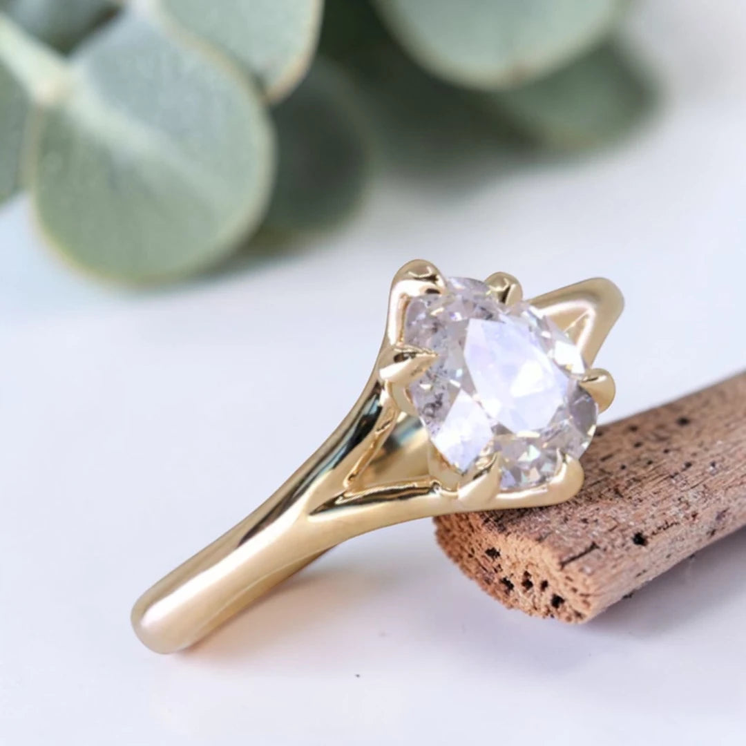 Pear cut salt and pepper diamond engagement ring featuring a 1.21 CT natural diamond with unique inclusions, set on a handcrafted split shank band in a minimalist alternative bridal jewelry design.