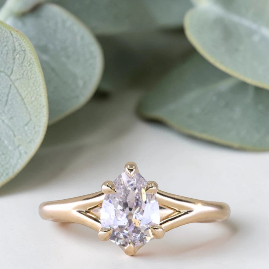 Pear cut salt and pepper diamond engagement ring featuring a 1.21 CT natural diamond with unique inclusions, set on a handcrafted split shank band in a minimalist alternative bridal jewelry design.