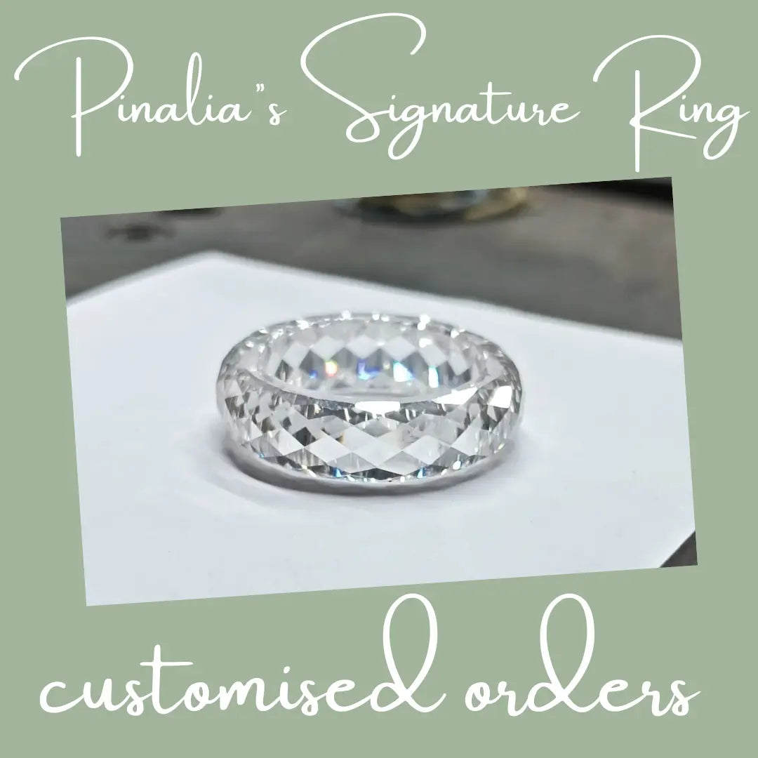 Pinalia’s signature ring featuring a distinctive natural diamond design with handcrafted fine jewelry detailing, showcasing a modern minimalist aesthetic and unique organic gemstone character in an elegant engagement style ring.