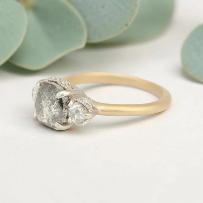 Rose cushion cut salt and pepper diamond vintage engagement ring featuring a 1.70 CT natural center diamond with galaxy-like inclusions and 0.35 CT round rose cut side diamonds on a handcrafted straight band design.