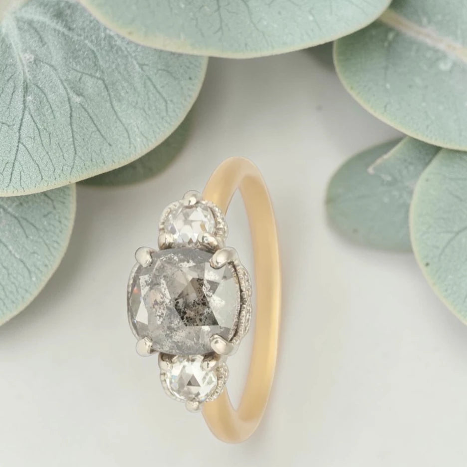 Rose cushion cut salt and pepper diamond vintage engagement ring featuring a 1.70 CT natural center diamond with galaxy-like inclusions and 0.35 CT round rose cut side diamonds on a handcrafted straight band design.