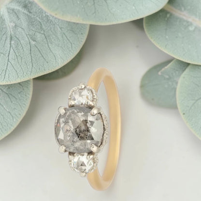 Rose cushion cut salt and pepper diamond vintage engagement ring featuring a 1.70 CT natural center diamond with galaxy-like inclusions and 0.35 CT round rose cut side diamonds on a handcrafted straight band design.