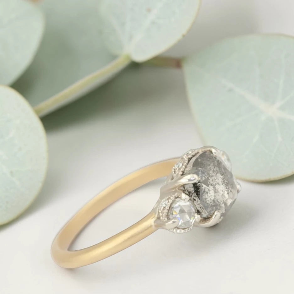 Rose cushion cut salt and pepper diamond vintage engagement ring featuring a 1.70 CT natural center diamond with galaxy-like inclusions and 0.35 CT round rose cut side diamonds on a handcrafted straight band design.