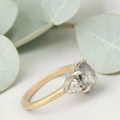Rose cushion cut salt and pepper diamond vintage engagement ring featuring a 1.70 CT natural center diamond with galaxy-like inclusions and 0.35 CT round rose cut side diamonds on a handcrafted straight band design.