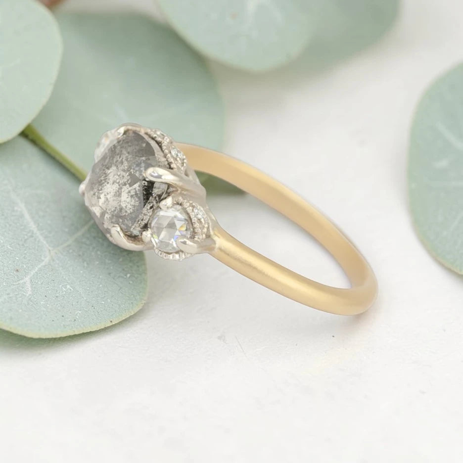 Rose cushion cut salt and pepper diamond vintage engagement ring featuring a 1.70 CT natural center diamond with galaxy-like inclusions and 0.35 CT round rose cut side diamonds on a handcrafted straight band design.