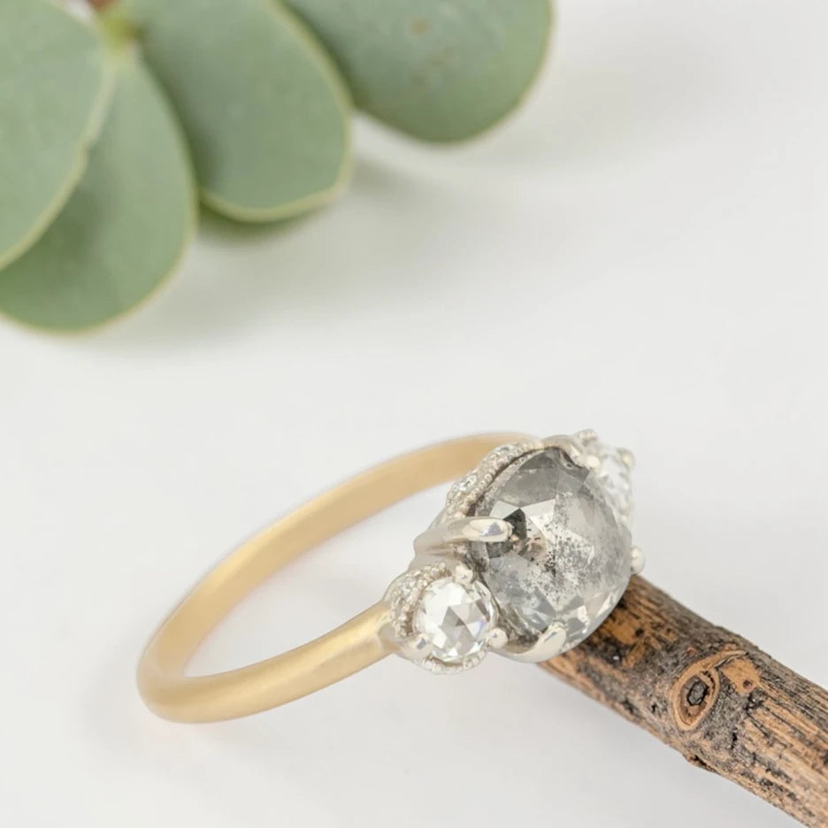 Rose cushion cut salt and pepper diamond vintage engagement ring featuring a 1.70 CT natural center diamond with galaxy-like inclusions and 0.35 CT round rose cut side diamonds on a handcrafted straight band design.