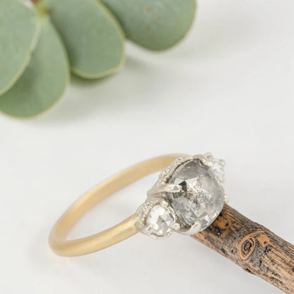 Rose cushion cut salt and pepper diamond vintage engagement ring featuring a 1.70 CT natural center diamond with galaxy-like inclusions and 0.35 CT round rose cut side diamonds on a handcrafted straight band design.