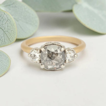 Rose cushion cut salt and pepper diamond vintage engagement ring featuring a 1.70 CT natural center diamond with galaxy-like inclusions and 0.35 CT round rose cut side diamonds on a handcrafted straight band design.