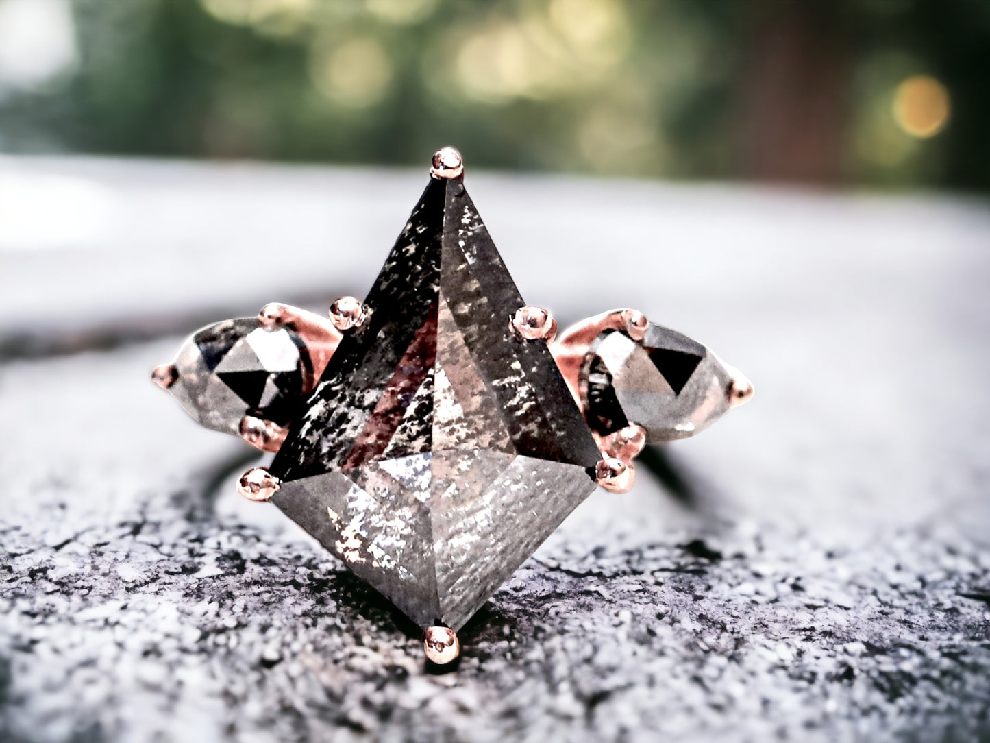 Rose Kite Cut Salt and Pepper Diamond Ring featuring a 5.87 CT natural salt and pepper diamond with smoky galaxy-like inclusions, accented by rose pear diamonds in a handmade modern engagement design with a straight 1.80 mm band and minimalist aesthetic.