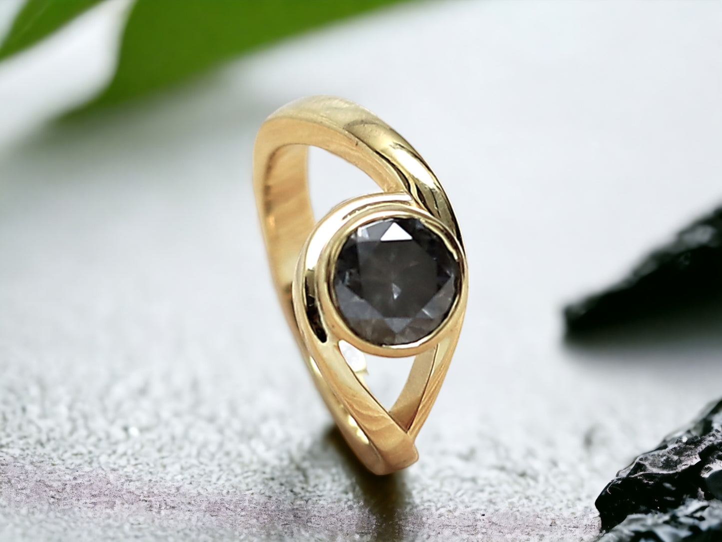 Round Brilliant Salt and Pepper Diamond Ring featuring a 1.75 CT natural salt and pepper diamond with galaxy-like black and white inclusions in a minimalist handcrafted gold design with a straight 1.8 to 1.9 mm band and rose cut finish.