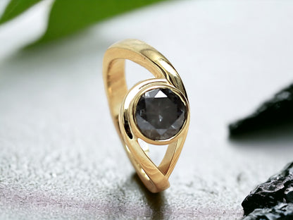 Round Brilliant Salt and Pepper Diamond Ring featuring a 1.75 CT natural salt and pepper diamond with galaxy-like black and white inclusions in a minimalist handcrafted gold design with a straight 1.8 to 1.9 mm band and rose cut finish.