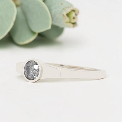 Round Cut Salt and Pepper Diamond Ring featuring a 0.27 CT natural salt and pepper diamond with organic inclusions in a minimalist handmade design with a reverse tapered 2.65 mm band and modern fine jewelry aesthetic.
