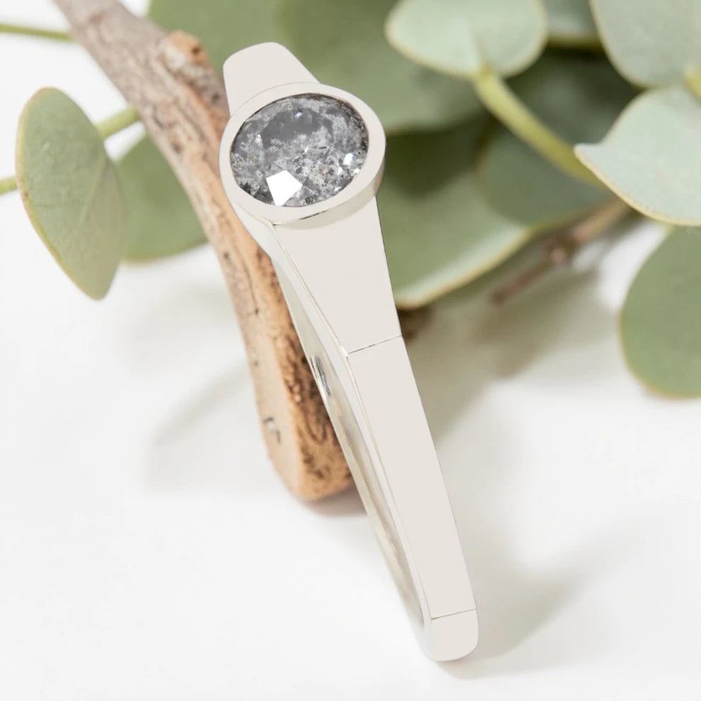 Round Cut Salt and Pepper Diamond Ring featuring a 0.27 CT natural salt and pepper diamond with organic inclusions in a minimalist handmade design with a reverse tapered 2.65 mm band and modern fine jewelry aesthetic.