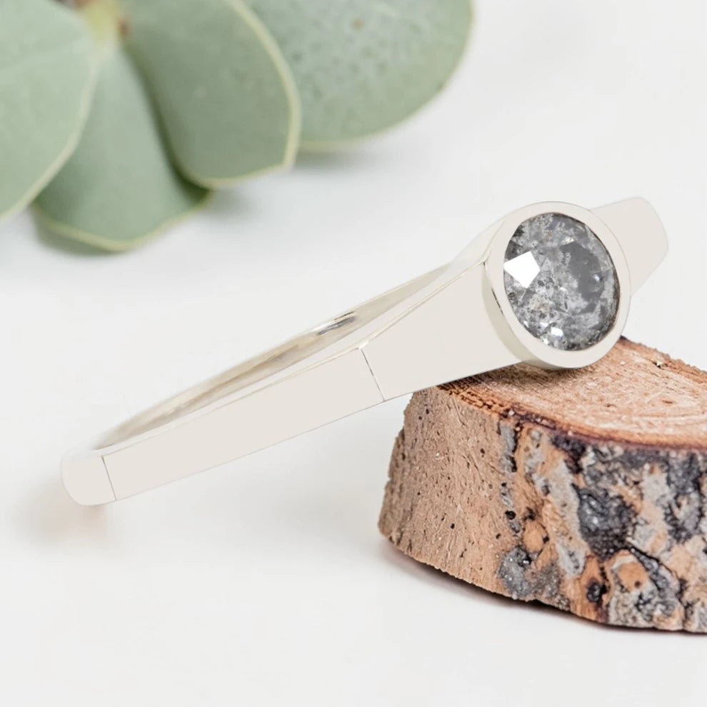 Round Cut Salt and Pepper Diamond Ring featuring a 0.27 CT natural salt and pepper diamond with organic inclusions in a minimalist handmade design with a reverse tapered 2.65 mm band and modern fine jewelry aesthetic.
