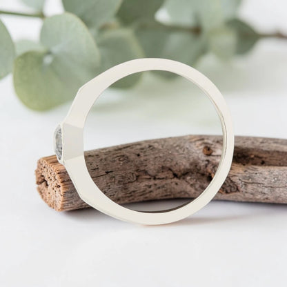 Round Cut Salt and Pepper Diamond Ring featuring a 0.27 CT natural salt and pepper diamond with organic inclusions in a minimalist handmade design with a reverse tapered 2.65 mm band and modern fine jewelry aesthetic.
