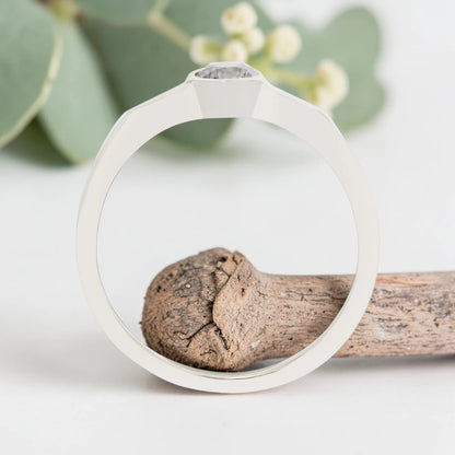 Round Cut Salt and Pepper Diamond Ring featuring a 0.27 CT natural salt and pepper diamond with organic inclusions in a minimalist handmade design with a reverse tapered 2.65 mm band and modern fine jewelry aesthetic.