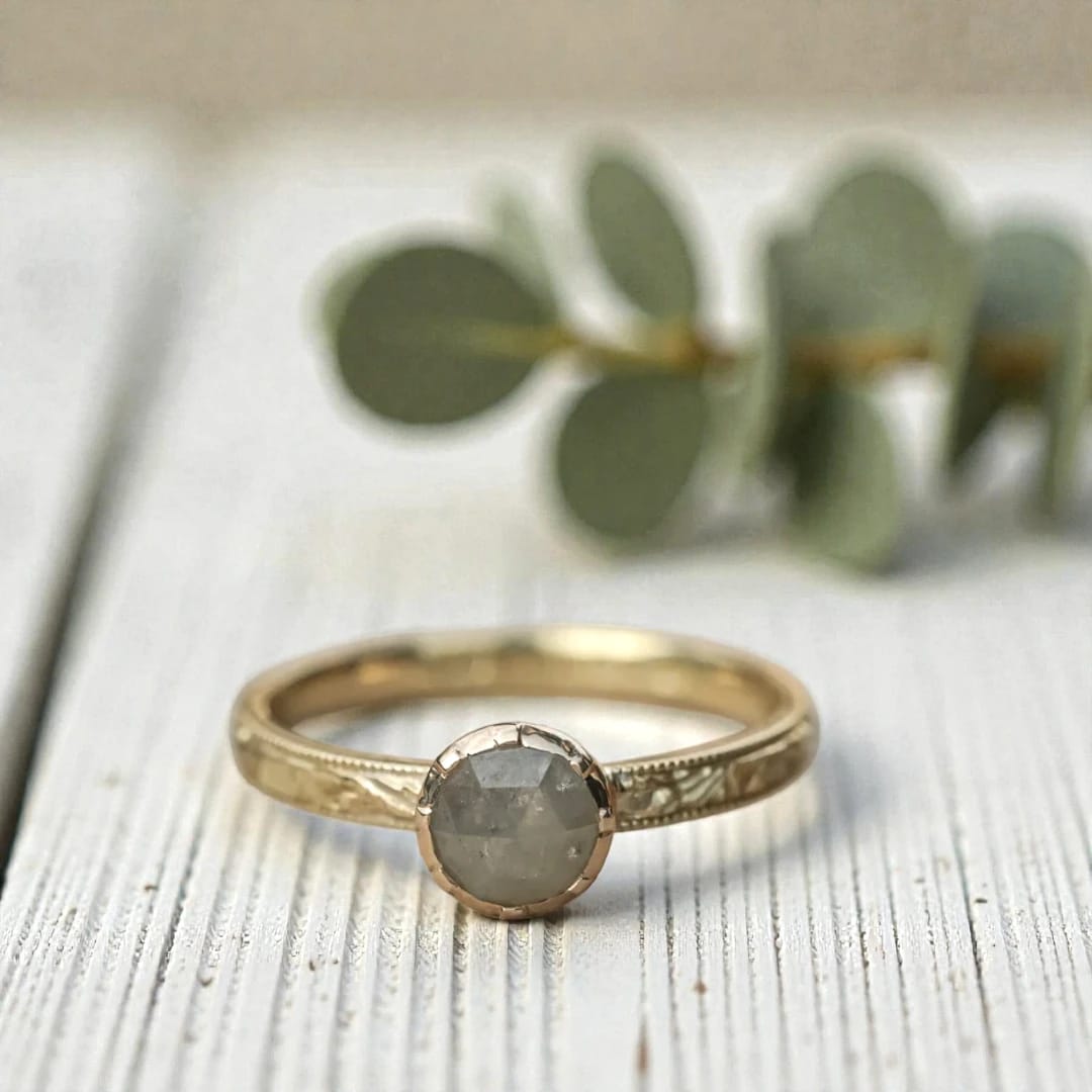 Round diamond ring inspired by ethical natural diamond beauty featuring a minimalist handcrafted design with a natural round diamond center stone and refined fine jewelry aesthetic suitable for engagement and everyday wear.
