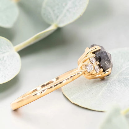 Round Rose Cut Salt and Pepper Diamond Cluster Engagement Ring featuring a 2.31 CT natural black salt and pepper diamond with unique inclusions, surrounded by six round accent diamonds on a handcrafted straight band design.