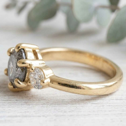 Round Salt and Pepper Diamond Engagement Ring featuring a 1.00 CT natural salt and pepper diamond with organic inclusions, accented by round brilliant side diamonds in a minimalist straight shank design with a 1.80 mm band in fine gold.