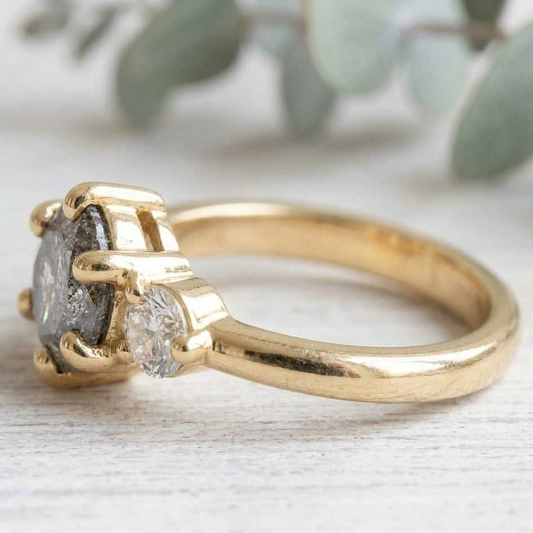 Round Salt and Pepper Diamond Engagement Ring featuring a 1.00 CT natural salt and pepper diamond with organic inclusions, accented by round brilliant side diamonds in a minimalist straight shank design with a 1.80 mm band in fine gold.