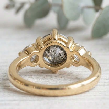 Round Salt and Pepper Diamond Engagement Ring featuring a 1.00 CT natural salt and pepper diamond with organic inclusions, accented by round brilliant side diamonds in a minimalist straight shank design with a 1.80 mm band in fine gold.
