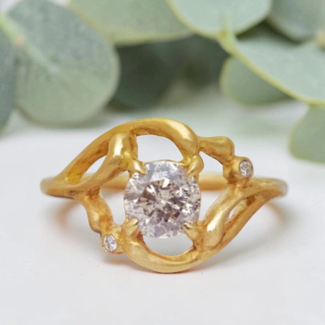 Salt and Pepper Diamond Twist Shank Engagement Ring featuring a 0.85 CT natural brilliant cut salt and pepper diamond with black and white inclusions, accented by round salt and pepper side diamonds in a handmade alternative bridal design.