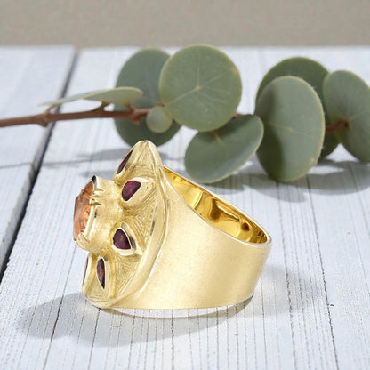 Sapphire engagement ring in solid gold featuring a deep blue center sapphire with vintage inspired charm, handcrafted detailing, and a timeless elegant fine jewelry design suitable for engagement and bridal wear.