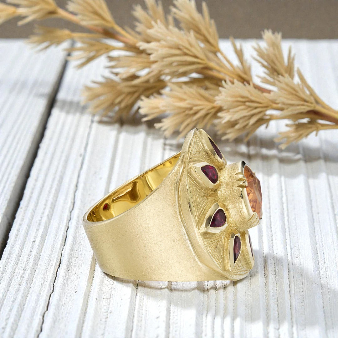 Sapphire engagement ring in solid gold featuring a deep blue center sapphire with vintage inspired charm, handcrafted detailing, and a timeless elegant fine jewelry design suitable for engagement and bridal wear.