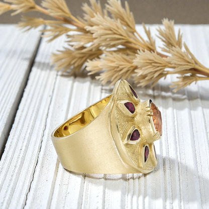 Sapphire engagement ring in solid gold featuring a deep blue center sapphire with vintage inspired charm, handcrafted detailing, and a timeless elegant fine jewelry design suitable for engagement and bridal wear.