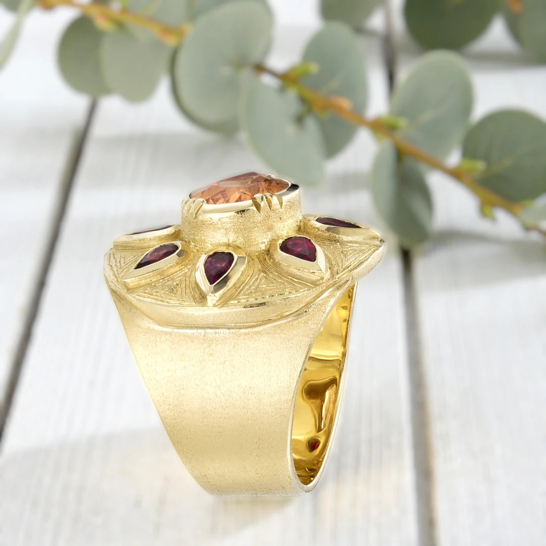 Sapphire engagement ring in solid gold featuring a deep blue center sapphire with vintage inspired charm, handcrafted detailing, and a timeless elegant fine jewelry design suitable for engagement and bridal wear.