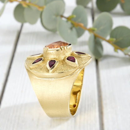 Sapphire engagement ring in solid gold featuring a deep blue center sapphire with vintage inspired charm, handcrafted detailing, and a timeless elegant fine jewelry design suitable for engagement and bridal wear.