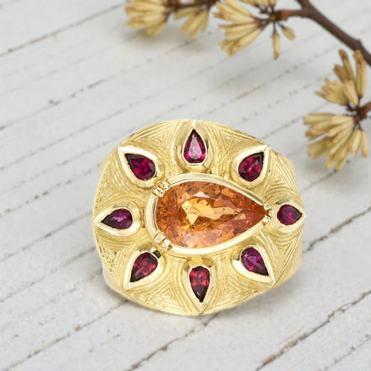 Sapphire engagement ring in solid gold featuring a deep blue center sapphire with vintage inspired charm, handcrafted detailing, and a timeless elegant fine jewelry design suitable for engagement and bridal wear.