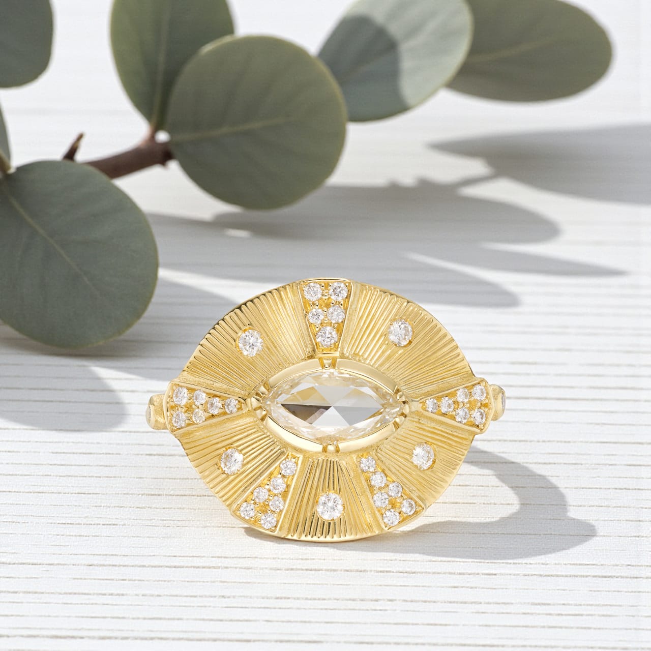Victorian style diamond ring featuring an engraved talisman design with intricate handcrafted detailing, antique inspired metalwork, and a timeless elegant engagement ring aesthetic with vintage fine jewelry craftsmanship.