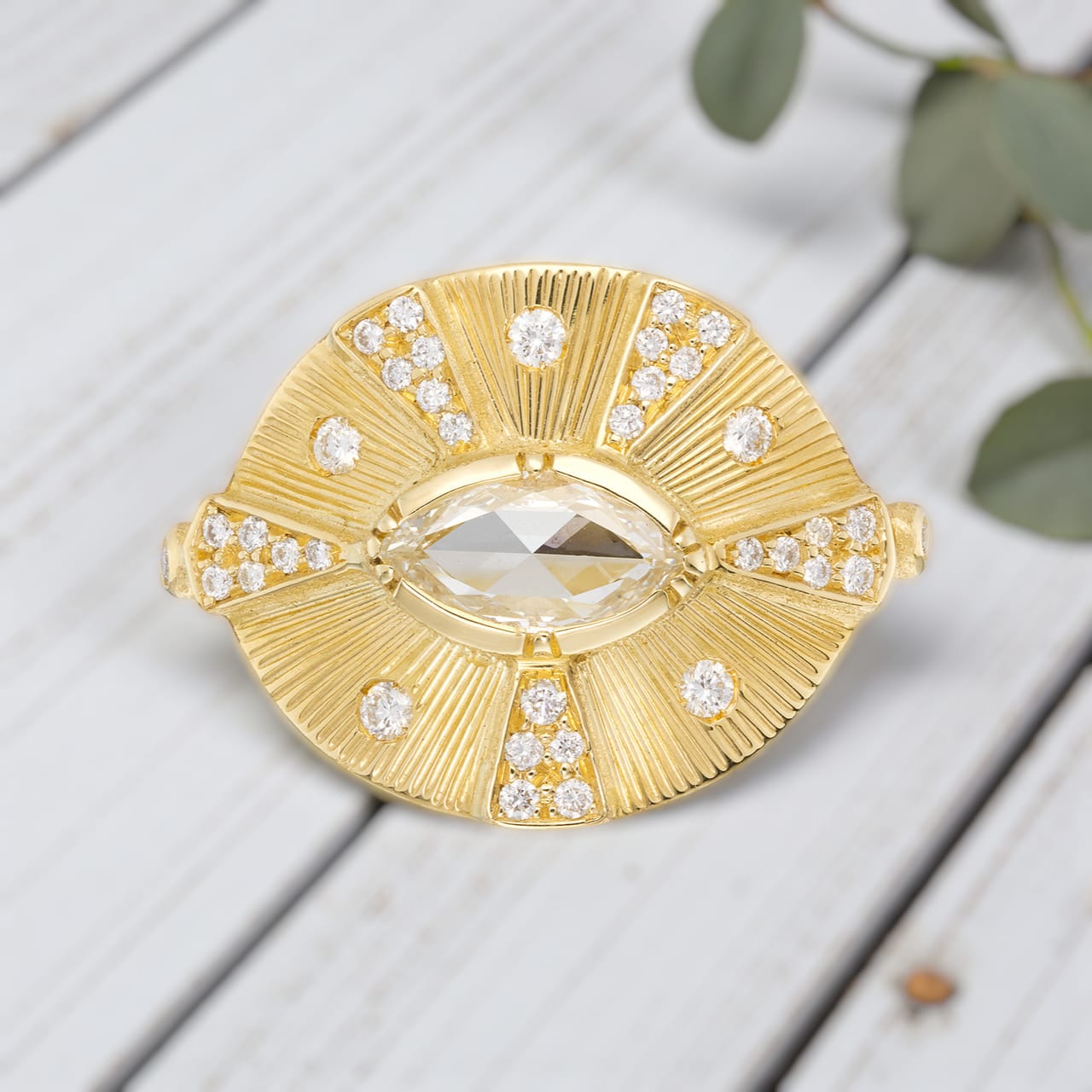 Victorian style diamond ring featuring an engraved talisman design with intricate handcrafted detailing, antique inspired metalwork, and a timeless elegant engagement ring aesthetic with vintage fine jewelry craftsmanship.