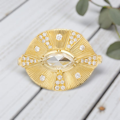 Victorian style diamond ring featuring an engraved talisman design with intricate handcrafted detailing, antique inspired metalwork, and a timeless elegant engagement ring aesthetic with vintage fine jewelry craftsmanship.