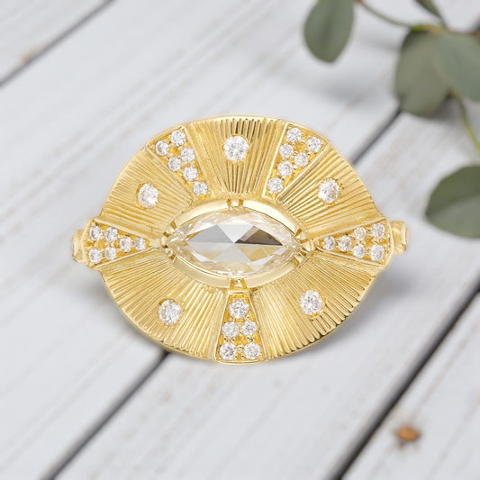Victorian style diamond ring featuring an engraved talisman design with intricate handcrafted detailing, antique inspired metalwork, and a timeless elegant engagement ring aesthetic with vintage fine jewelry craftsmanship.